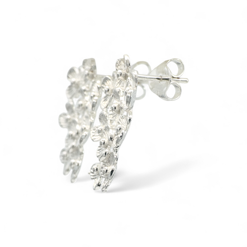 Aros flores gota movimiento plateados cortos