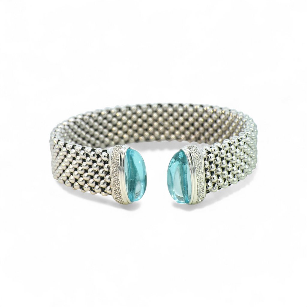 Pulsera ancha tejida en plata 925 con topacios azules y circones