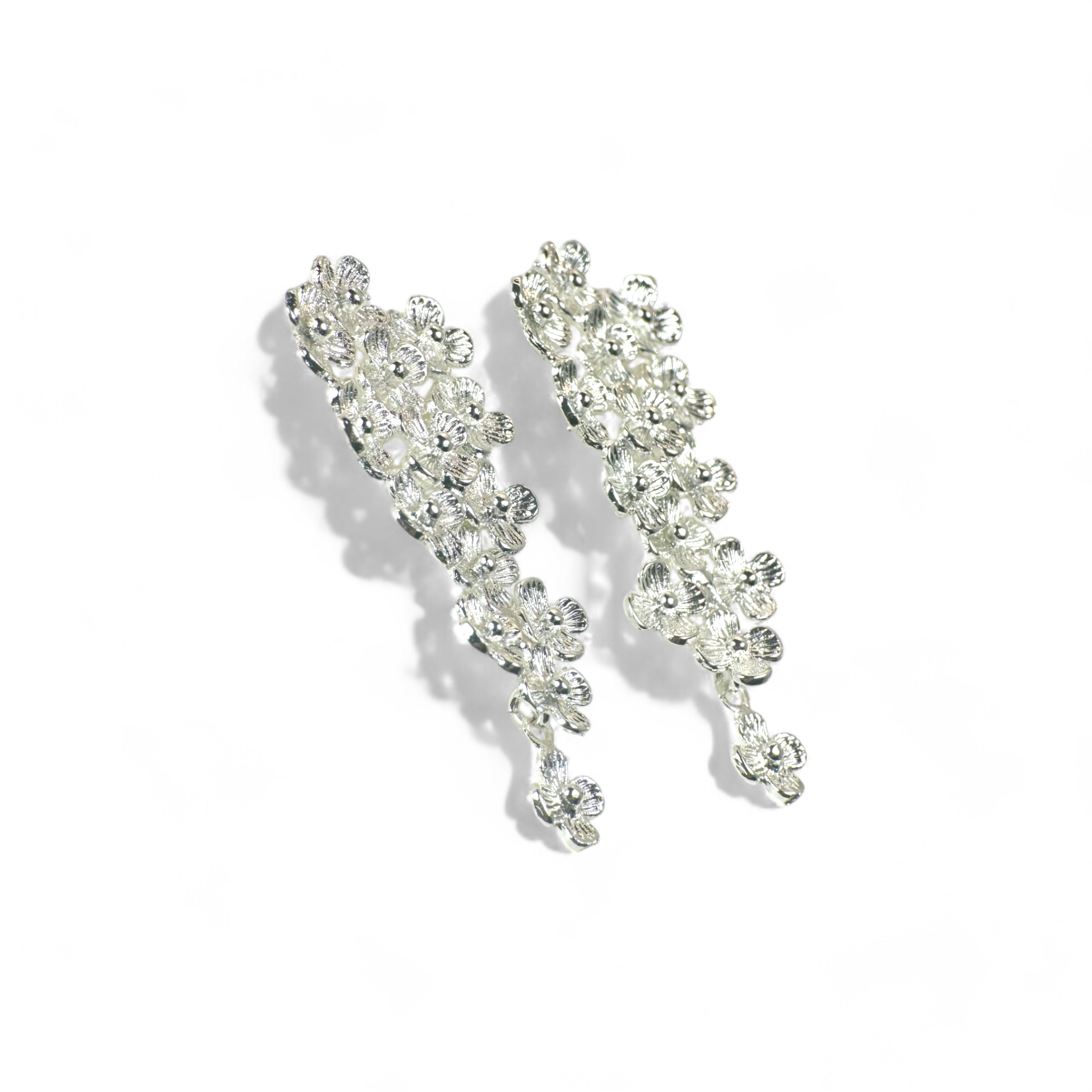 Aros flores gota movimiento plateados