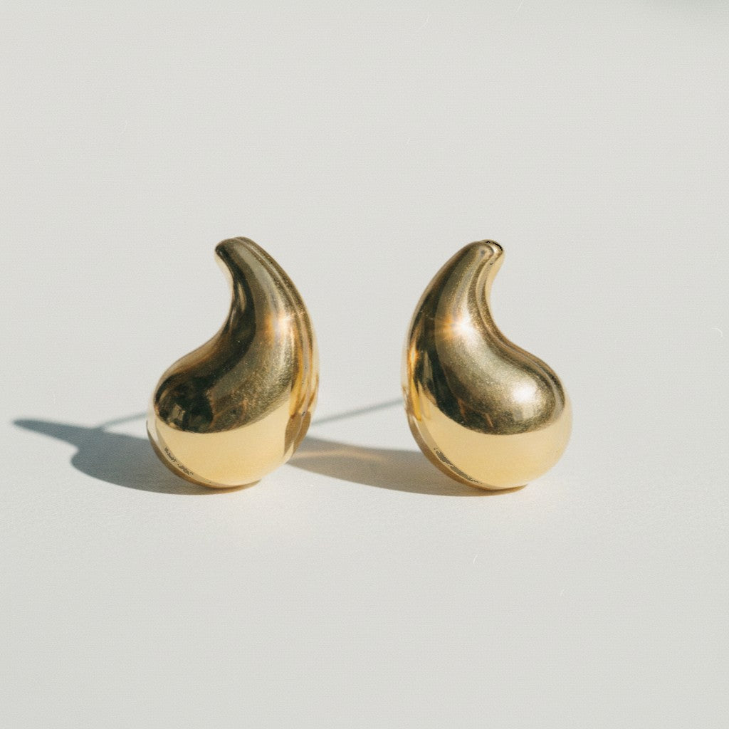 ClaraJoyas medium wide teardrop earrings in polished gold-plated bronze.