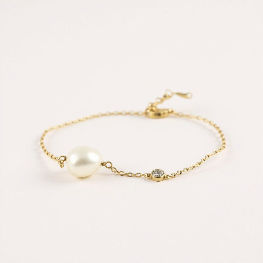 Pulsera Perla Oval 9 mm y circón bisel dorada