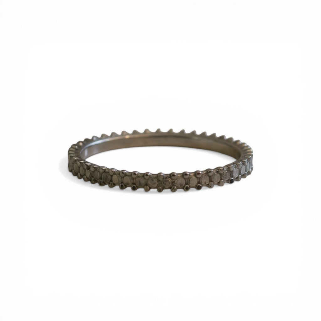 Sophia Schneider Joyas thin silver band ring with ruthenum plating and small diamonds.