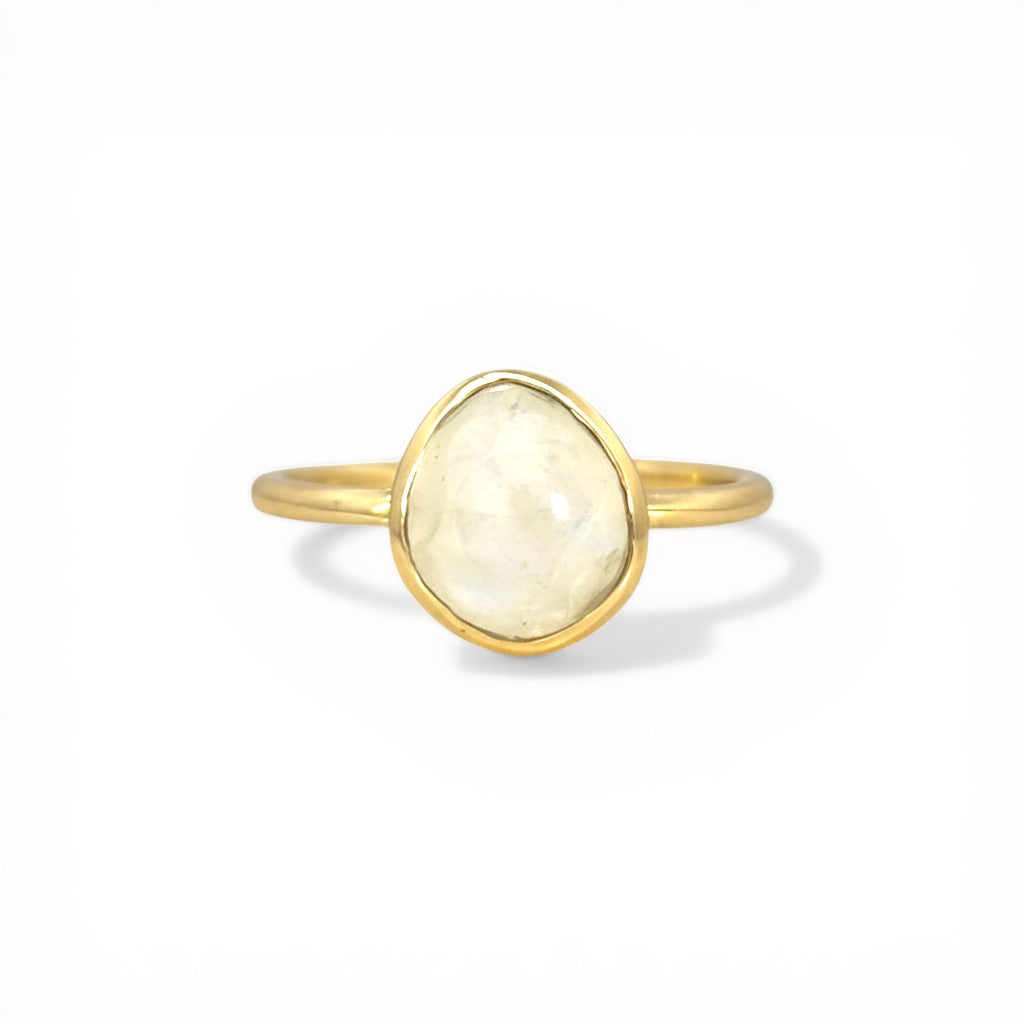 Sophia Schneider Joyas gold-plated silver ring with a white, bezel-set, pear-shaped stone. Size 13.