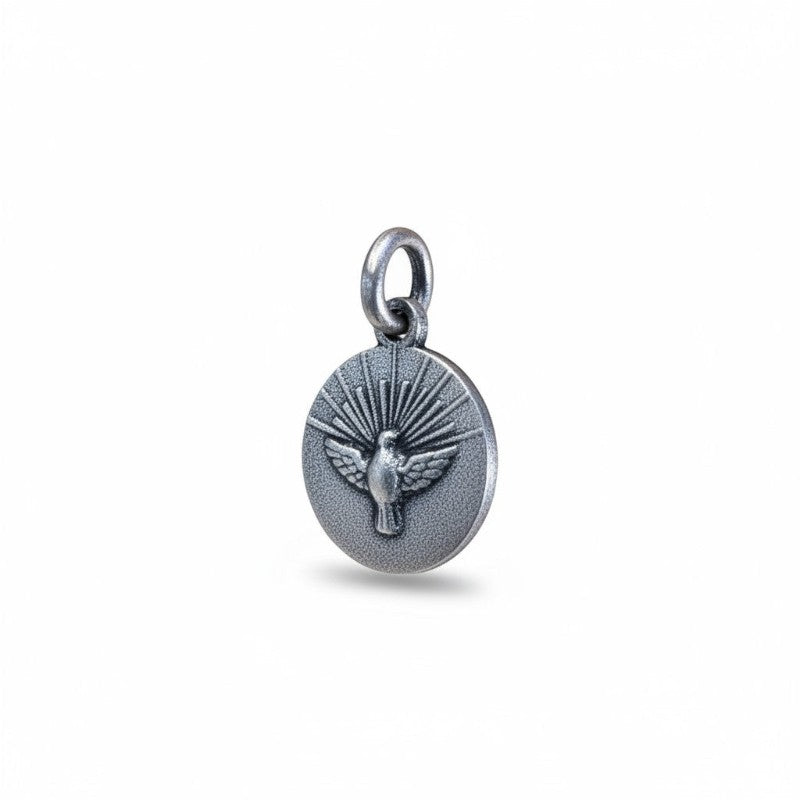 Sophia Schneider Joyas round 12mm Holy Spirit medal in sterling silver, featuring a dove with radiating rays.