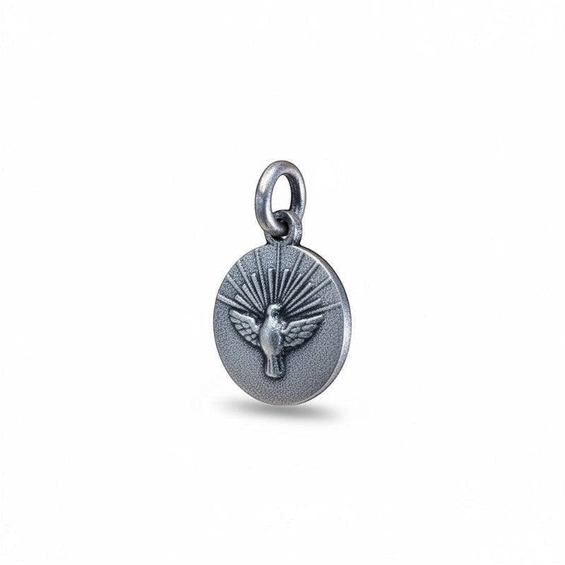 Sophia Schneider Joyas round 12mm Holy Spirit medal in sterling silver, featuring a dove with radiating rays.