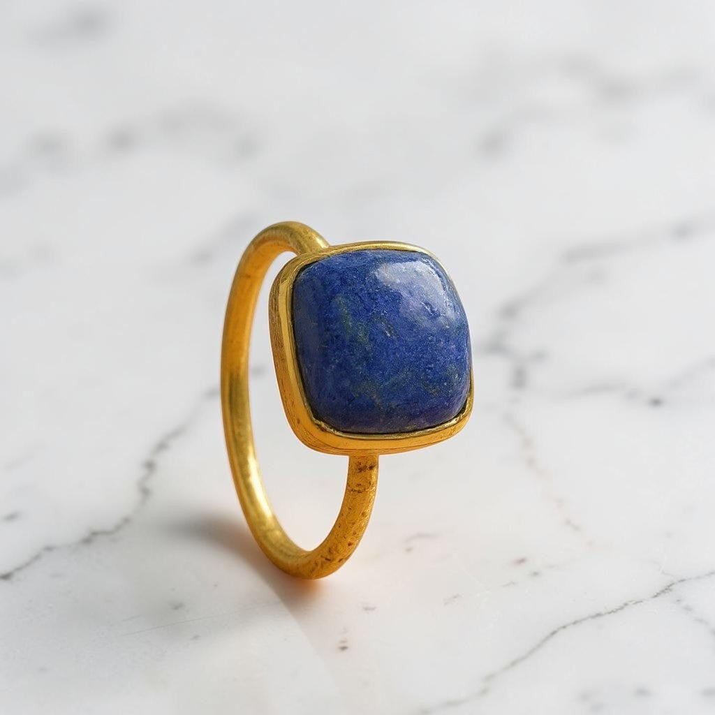 Sophia Schneider Joyas square lapis lazuli ring with gold bezel and textured band.