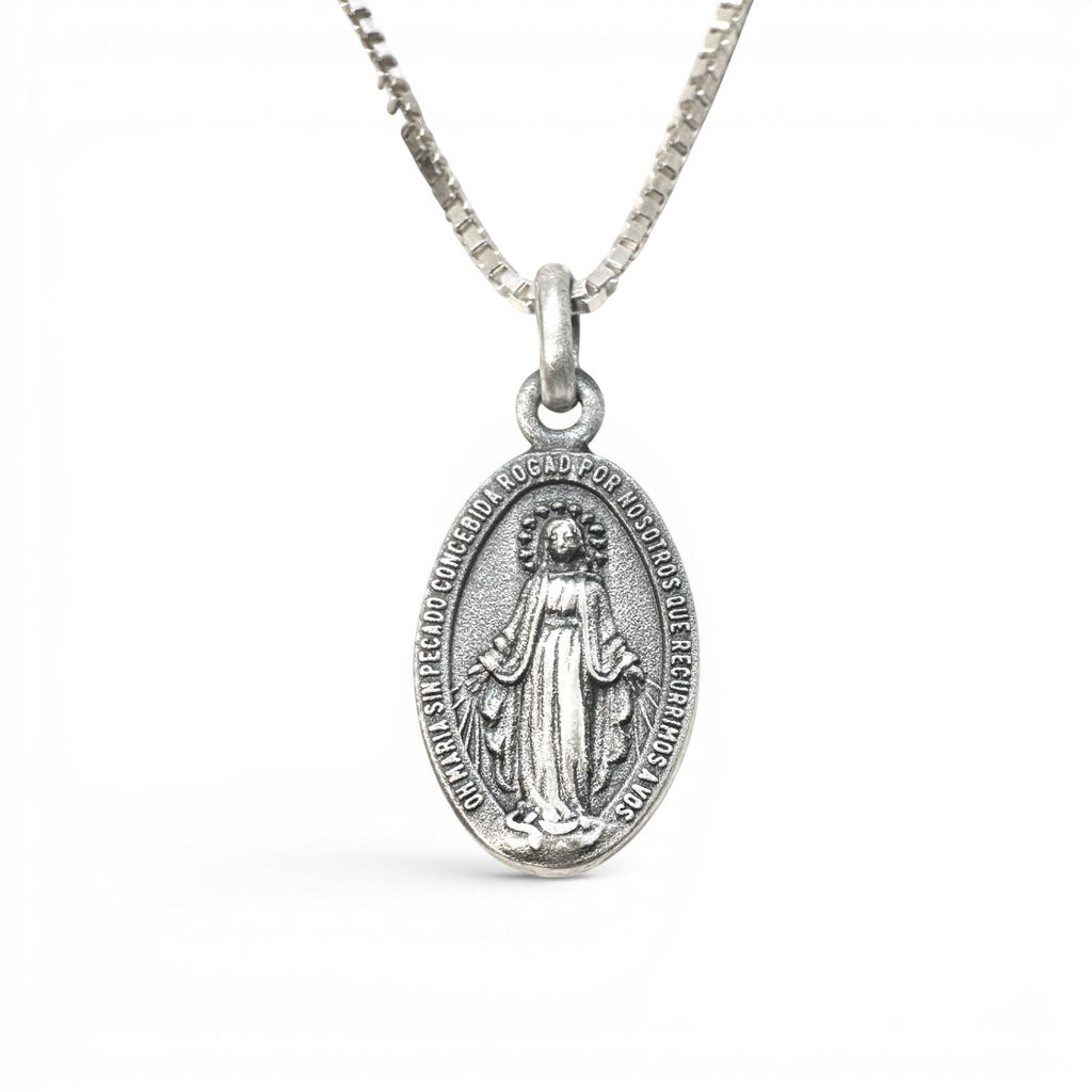 Sophia Schneider Joyas oval 16mm sterling silver medal of the Virgin of the Rays and Sacred Heart, with inscription.
