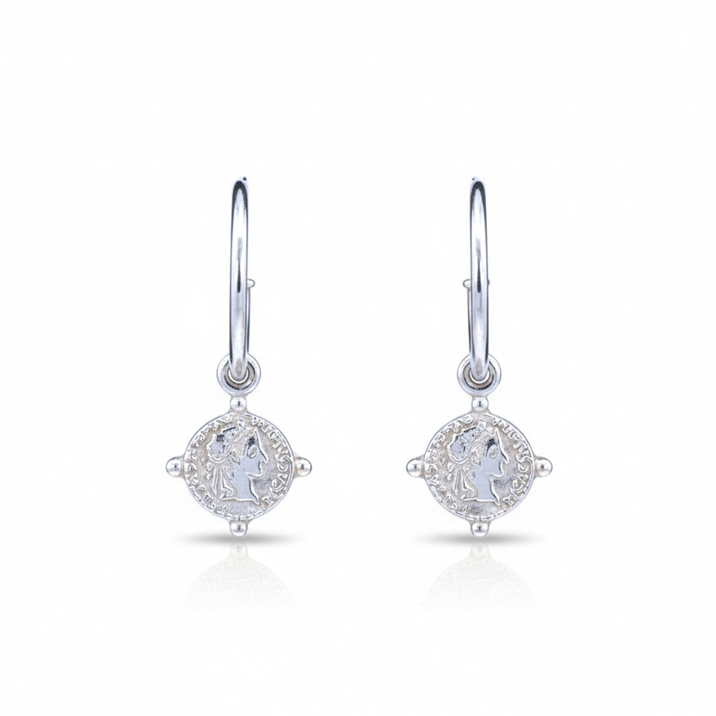 Sophia Schneider Joyas silver-plated hoop earrings with coin silhouette charms, 2.5 cm.