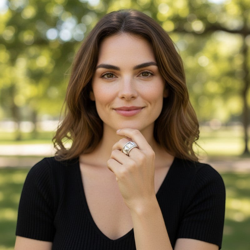 Sophia Schneider Joyas silver ring with pyramid stud design, rhodium plated, size 15.